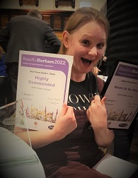 Sarah Cleeve looking happily surprised after receiving her "Keen to be Green" award at the Beautiful Durham Gardening Awards